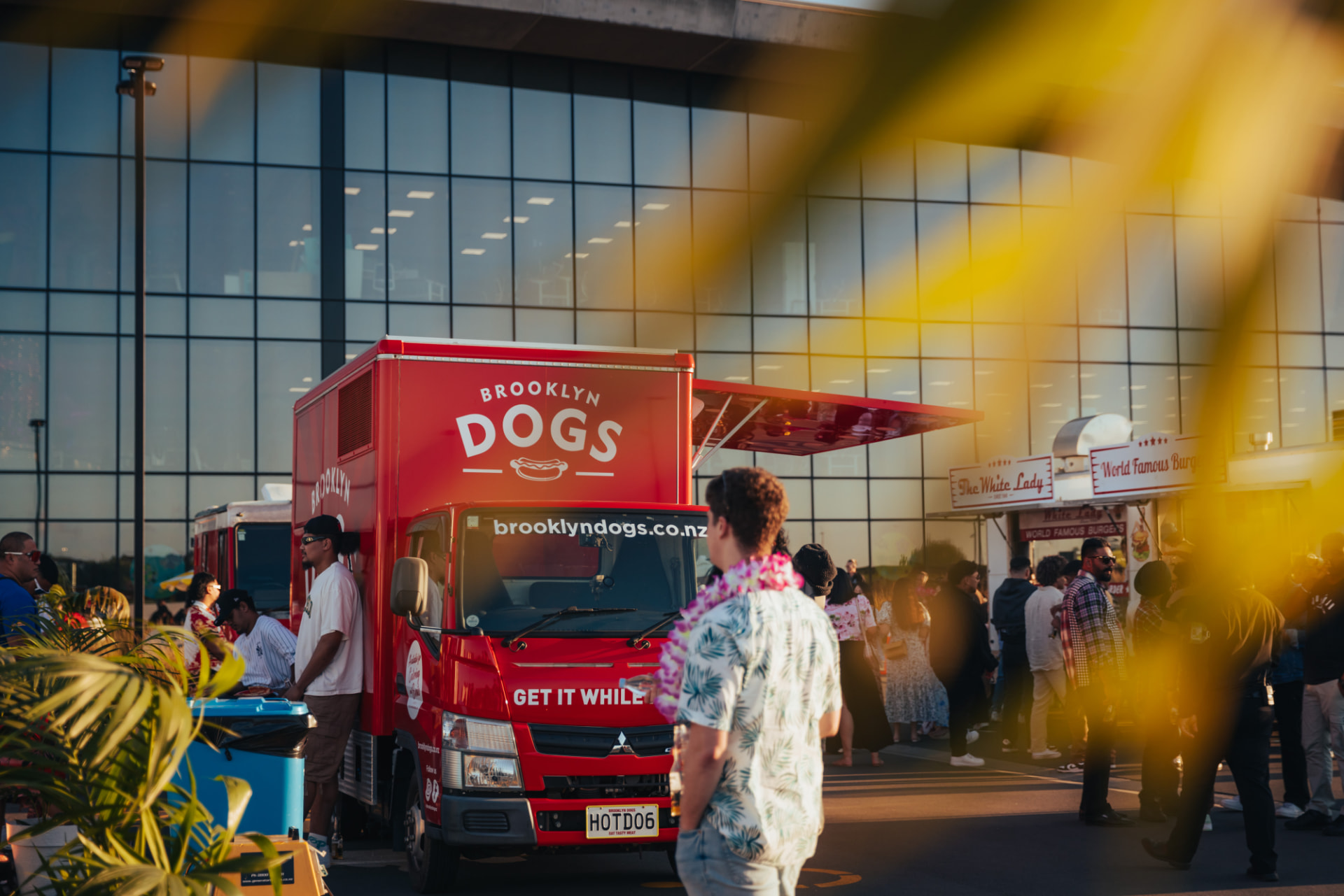 The Brooklyn Dogs truck glowing at an evening event
