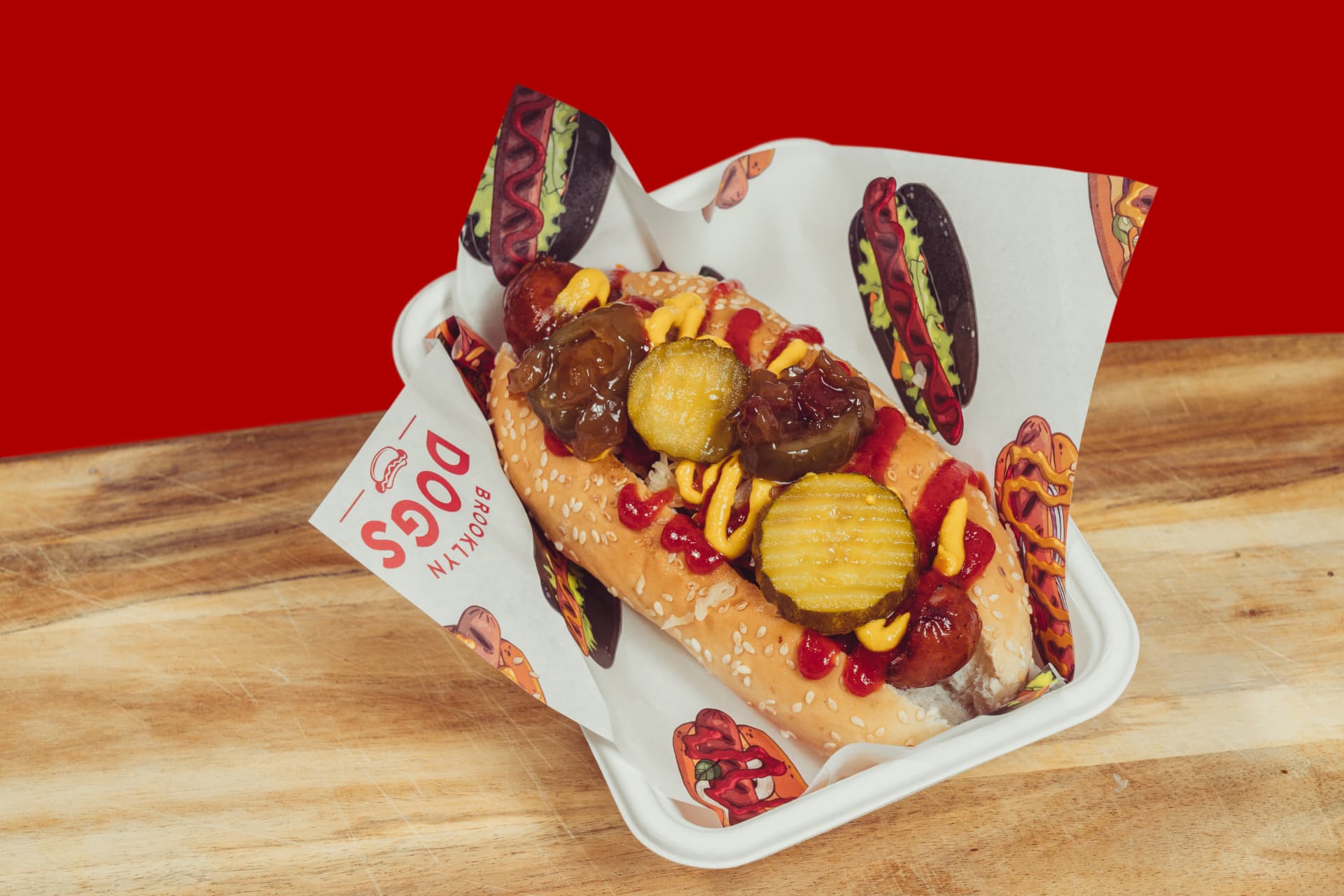 Brooklyn Dogs hot dog topped with pickles, mustard and relish