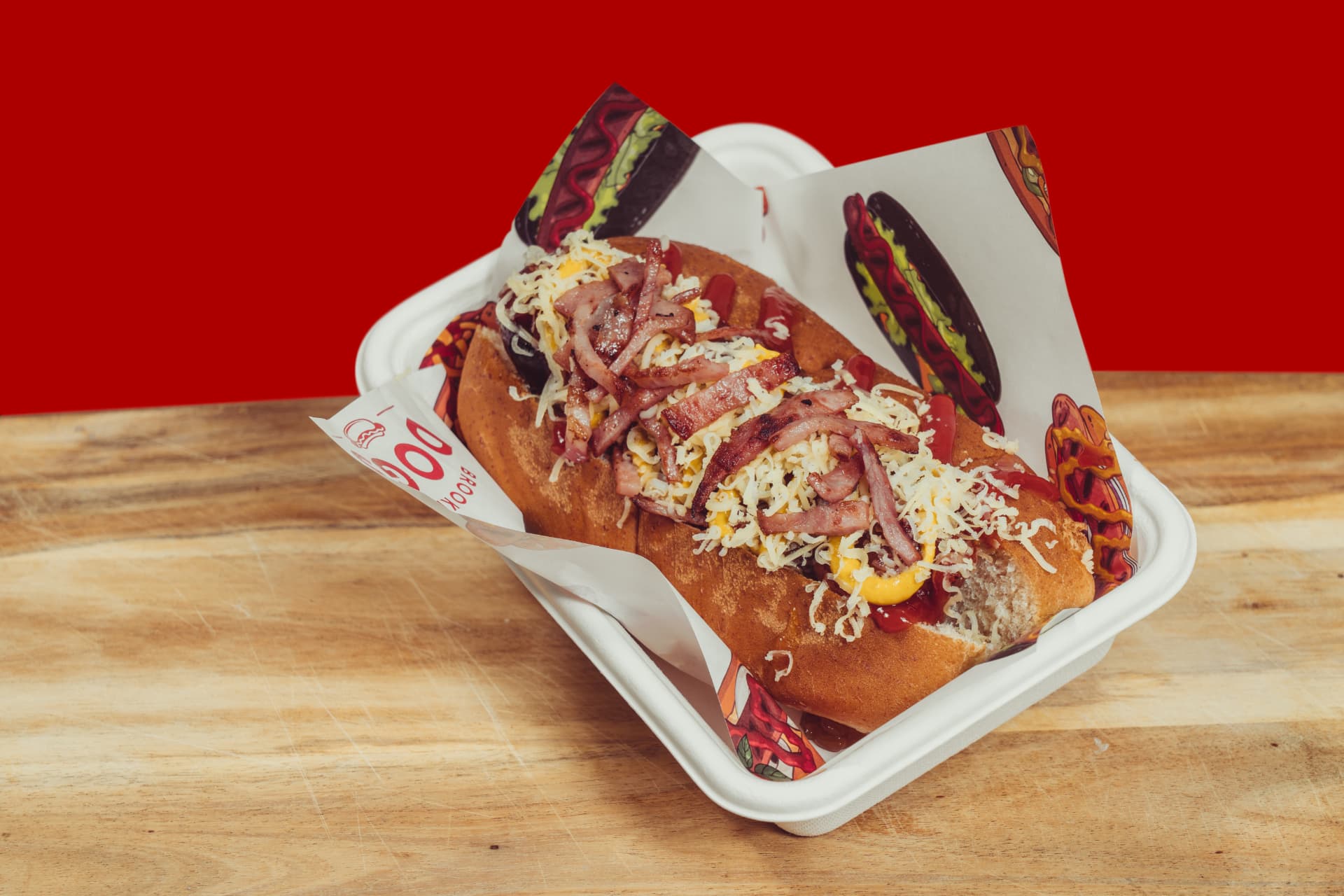 Brooklyn Dogs hot dog topped with bacon and grated cheese